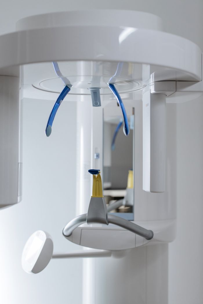 Close-up of a modern dental x-ray machine in a clinic, showcasing complex details.